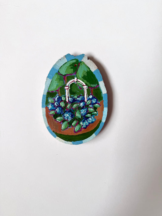 Blue hydrangeas under arch